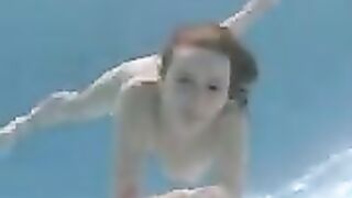 Swimming redhead girl