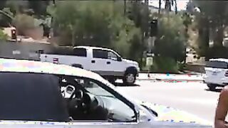 nude on the street passing out flowers