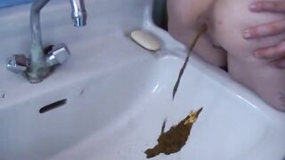Girl shitting in the sink