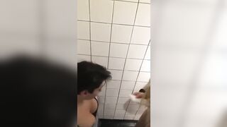 Couple getting wild and rough in the bathroom stall