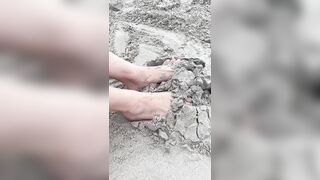 My size 5 feet playing in the sand