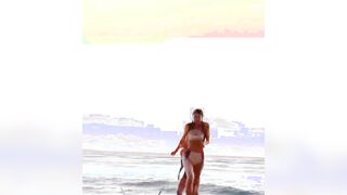 Alexandra Daddario and Sydney Sweeney running on the beach together