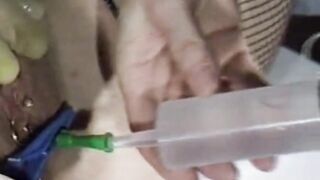 Retro Catheter Clip : Woman gets catheter inserted, her bladder filled with water then pees it out - from 1988. Info & link to full 60 minute video (free) in comments