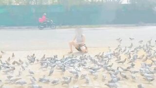 Opps moment while feeding the pigeons. I don’t know but people must have looked at my milky legs and blue thongs. [f] [female]