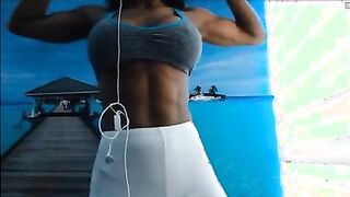 Muscular Ebony Personal Trainer Flexes Her Powerful Muscles