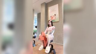 Songyuxin Hitomi riding a big toy