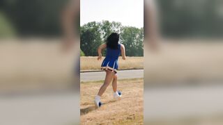 Camila Mendes as a cheerleader