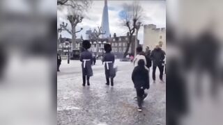 Meanwhile in England... The Queens Guard tramples a kid that got in the way